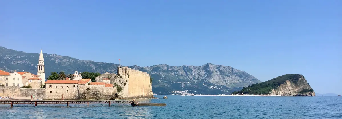 Budva Old Town and Sveti Nikola Island, seen from Mogren Beach