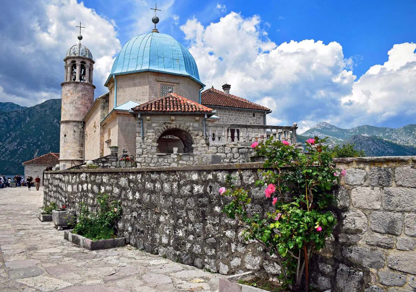 The church with its blue dome and round bell tower
